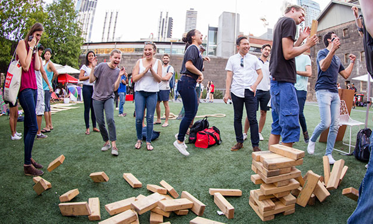 Students with oversized Jenga blocks 