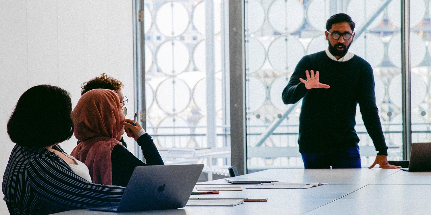 people collaborating at a whiteboard