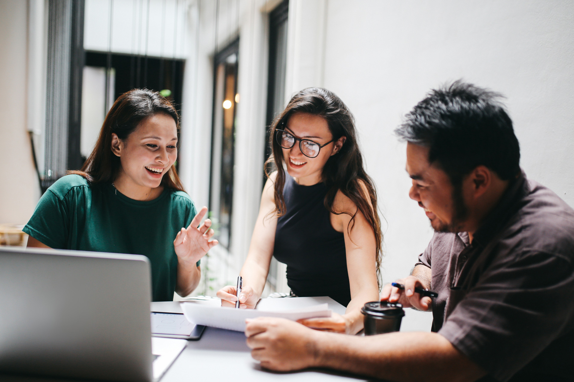 Staff working together at desk