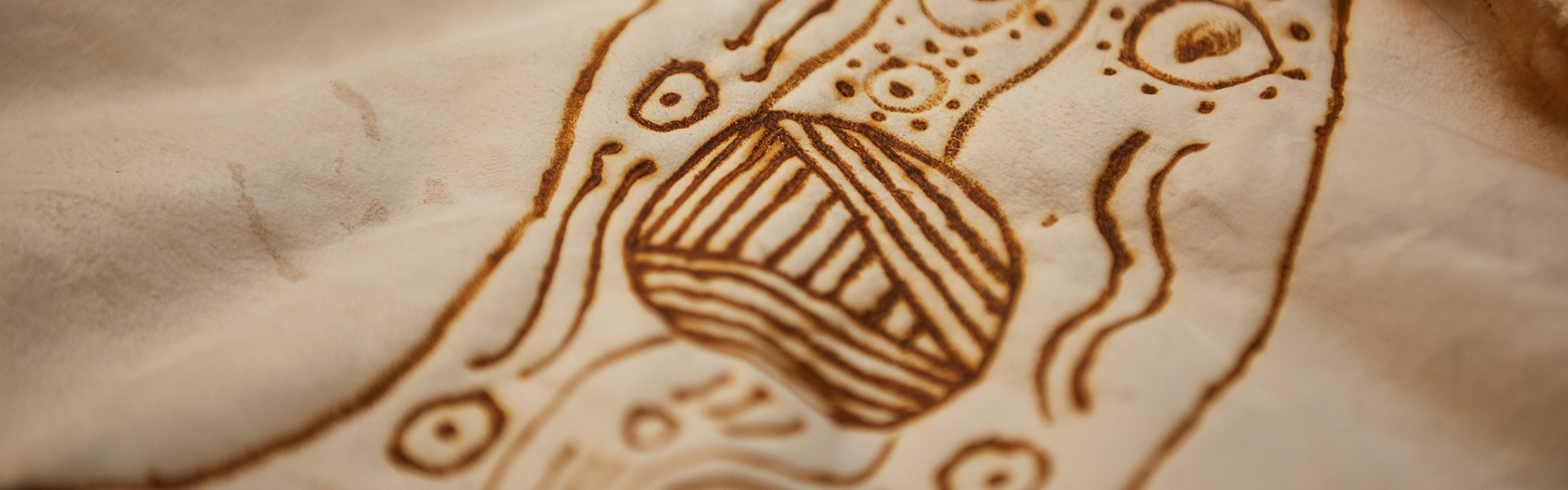 photograph of Indigenous artwork drawn on cream paper