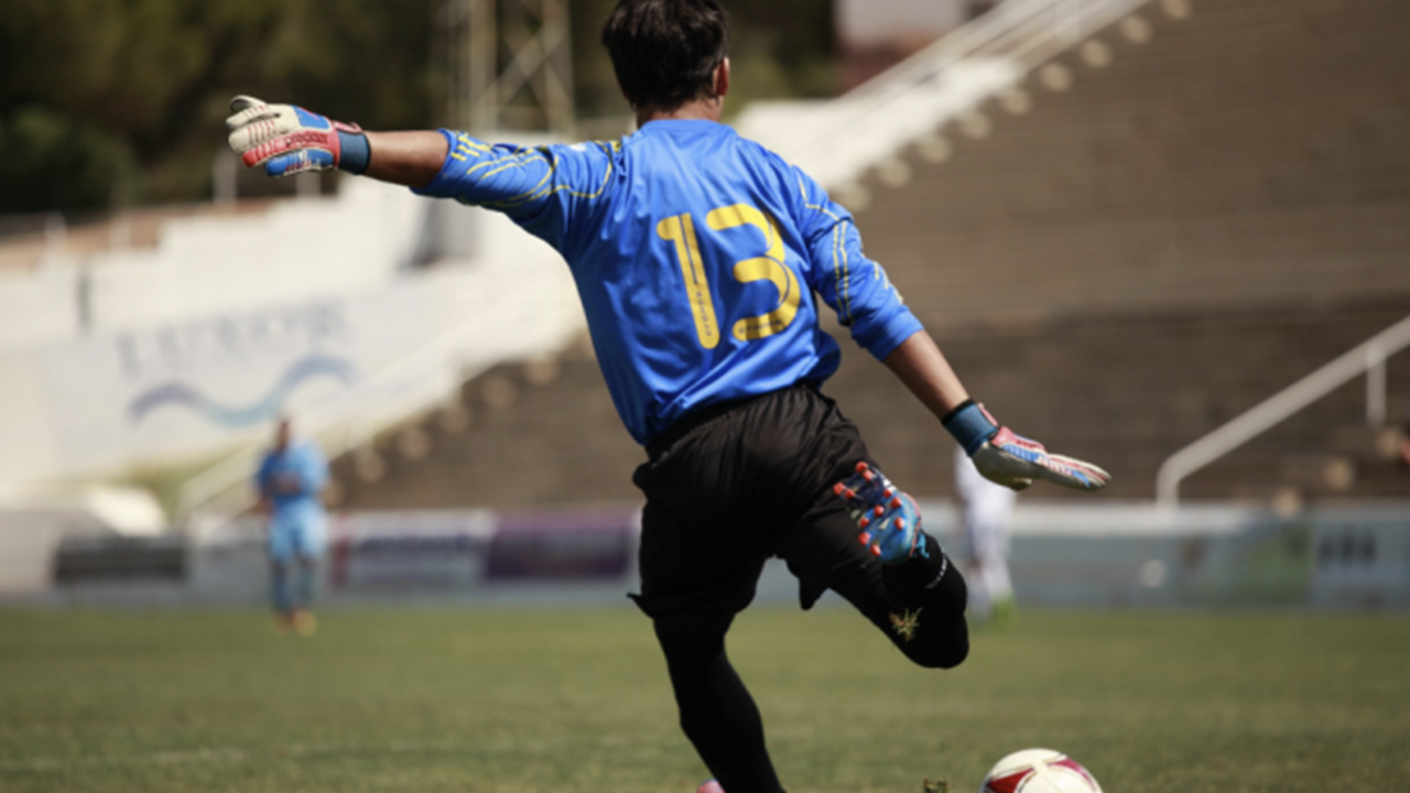 Man playing sport, football fitness.