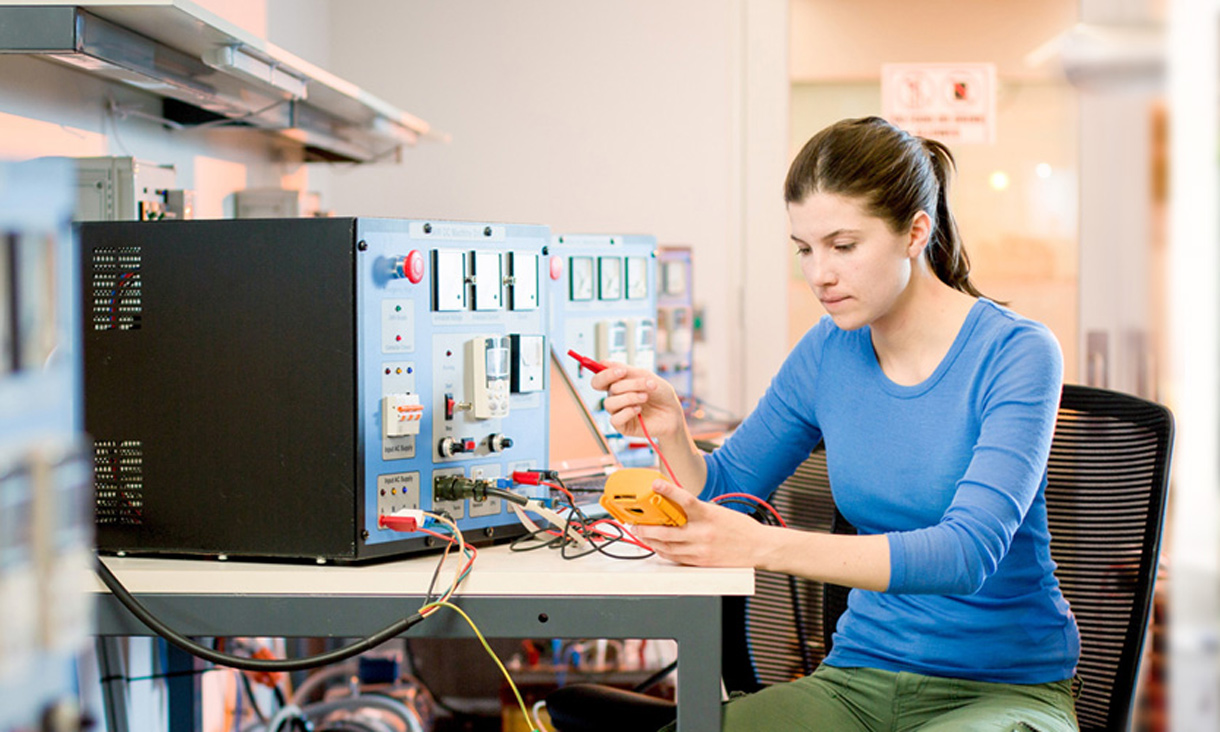 Students testing electrical wiring